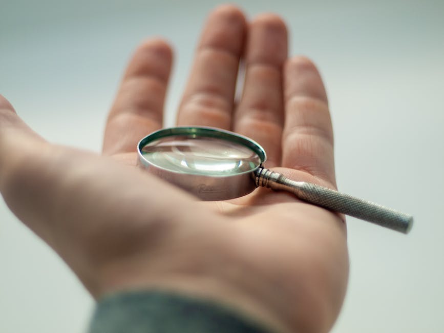 An image of a person holding a magnifying glass, looking at a computer screen with AI generated content on it.