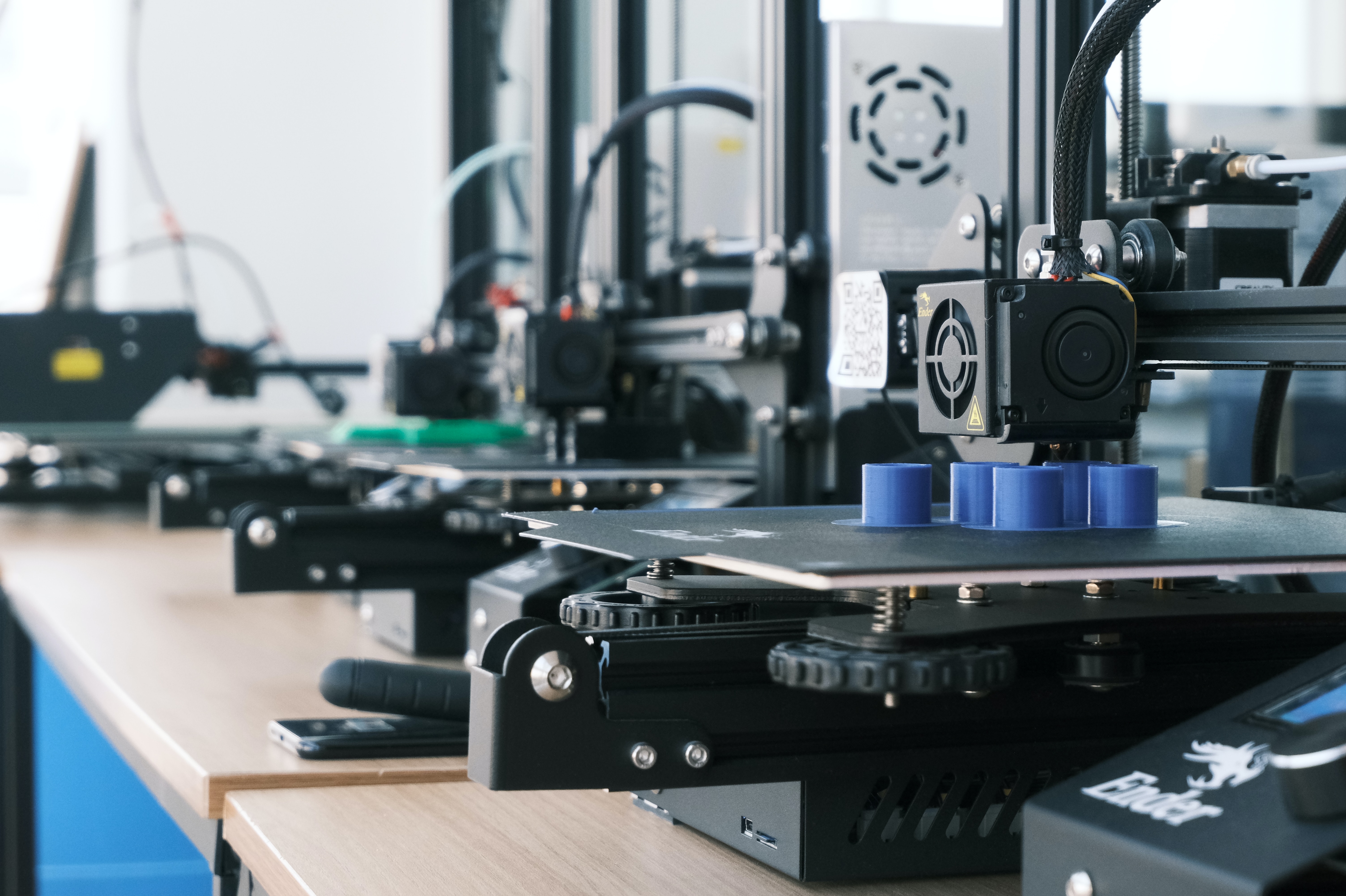 An image of a person adjusting the knobs and dials of a machine to optimize its performance for a specific task.